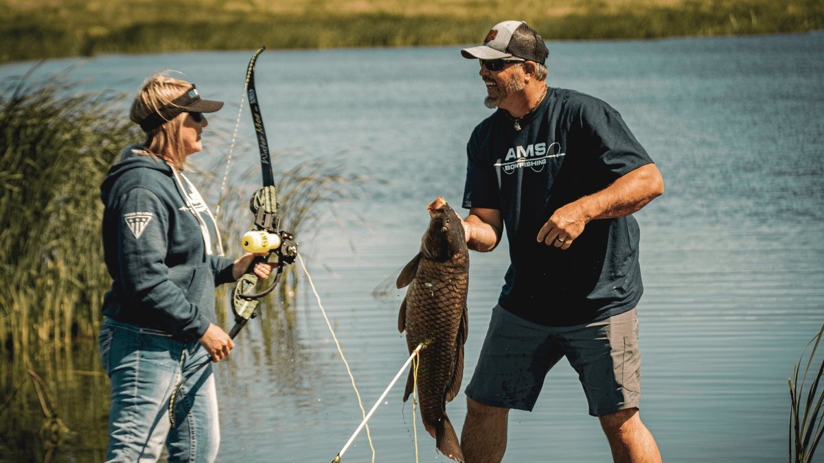 bow fishing strap on reel holder AMS Retriever Sport Bowfishing reliable and quick Bowfishing Reels | Bowfishing Reel